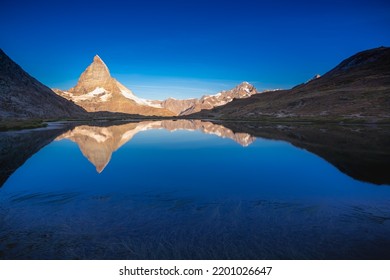 Matterhorn Iconic Mountain And Lake Relfection At Peaceful Sunrise, Swiss Alps