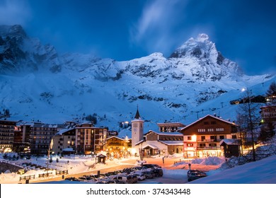 Matterhorn (Monte Cervino) mountain in moonlit blue evening. Cervina ski resort in the Alps, Valle'd Aosta, Italy