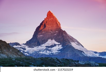 Matterhorn peak during sunrise. Beautiful natural landscape in the Switzerland. Mountains landscape at the summer time
