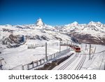 Matterhorn peak and Gornergrat railway station on top hill, Zermatt, Switzerland.