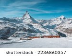Matterhorn, Switzerland, Winter tourist train with Matterhorn mountain in the background, Zermatt