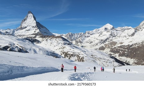 Matterhorn In Zermatt, Switzerland. Winter Hiking. People.