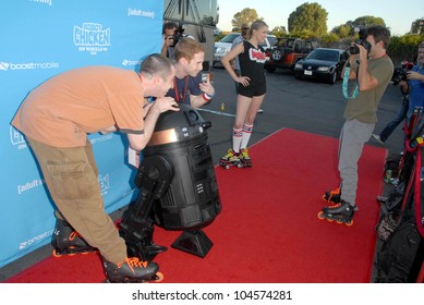 Matthew Senreich And Seth Green With Clare Grant And Breckin Meyer At Robot Chicken's Skate Party Bus Tour. Skateland, Northridge, CA. 08-01-09