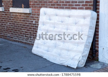 Similar – Image, Stock Photo Discarded mattress on the sidewalk in the light of a street lamp in front of an anonymous hotel façade