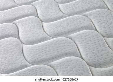 mattress isolated white background closeup