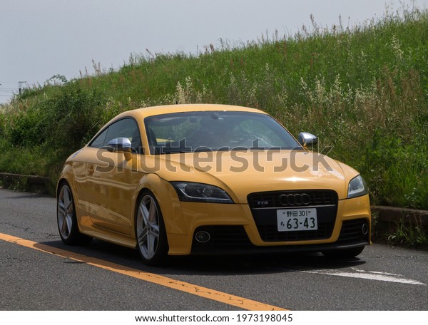 matudo-shi, Chiba,Japan,Spring,5,2021- orange sports\
car driving  on the open\
road
