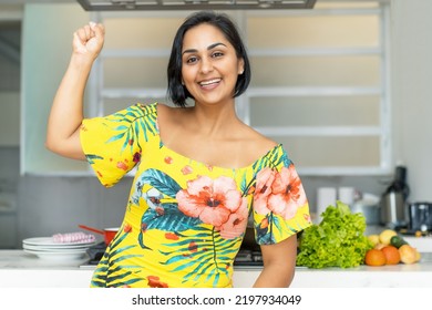 Mature Adult Hispanic Mother Or Housewife At Kitchen Indoors At Home