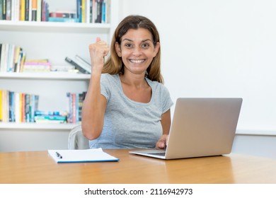 Mature Adult Student Cheering About Graduation At Home Or At Office