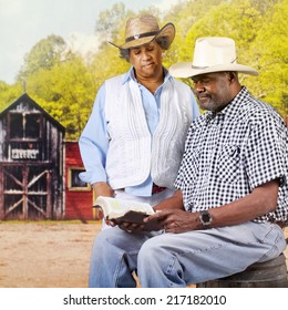 A Mature African American Cowboy Couple Reading The Bible In An Old Western Town. 