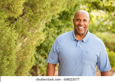 Mature African American Man Walking Outside.