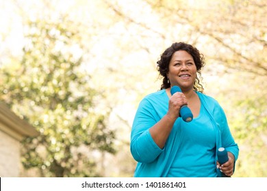 Mature African American woman smiling.
