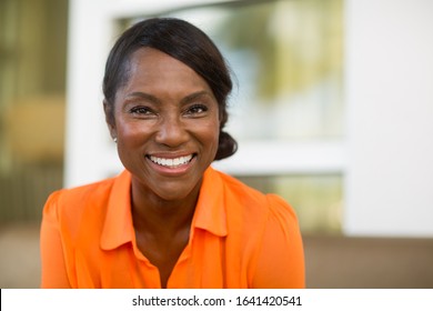 Mature African American woman smiling. - Powered by Shutterstock