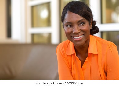 Mature African American woman smiling.