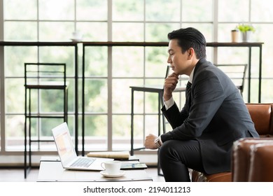 Mature Asian Business Man Working With Laptop Computer At The Office Work