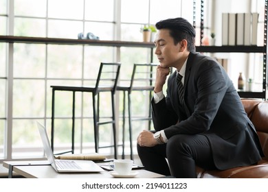 Mature Asian Business Man Working With Laptop Computer At The Office Work