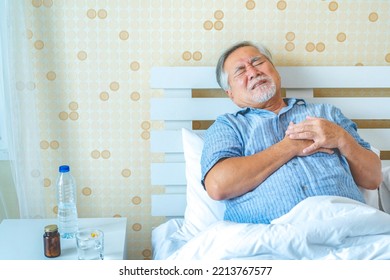 Mature Asian Man Chest Pain ,Retirement Life And Health Care, Investments, Insurance.