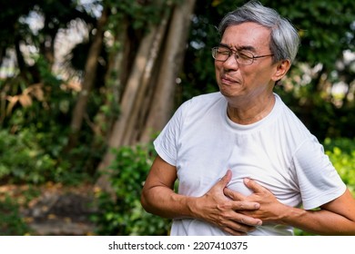 Mature Asian Man Chest Pain.life Insurance , Retirement.