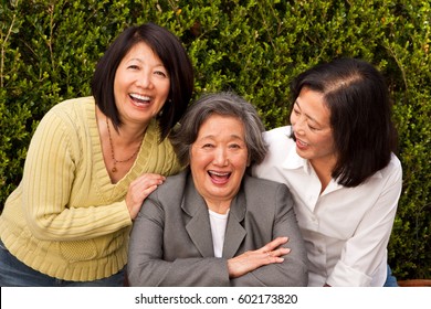 Mature Asian Mother And Her Adult Children.