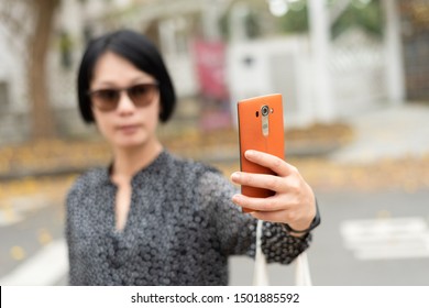 Mature Asian Woman Selfie In The Outside