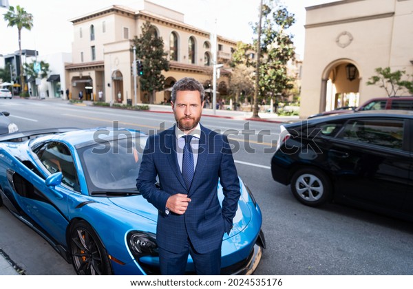 mature bearded businessman in expensive suit near
auto outdoor, business
success