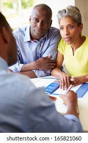 Mature Black Couple Meeting With Financial Advisor At Home