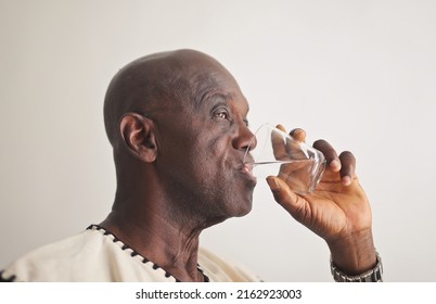 Mature Black Man Drinks Water