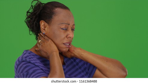 Mature Black Woman With Bad Neck Pain On Green Screen