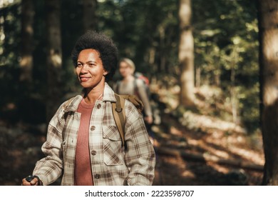 Mature Black Woman Hiking On Mountain In A Beautiful Sunny Autumn Day.