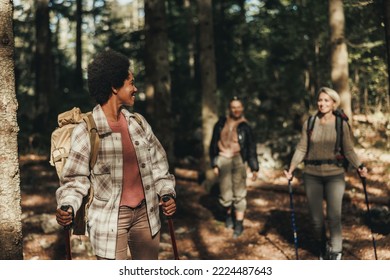 Mature Black Woman Hiking Through The Mountains With Her Friends.