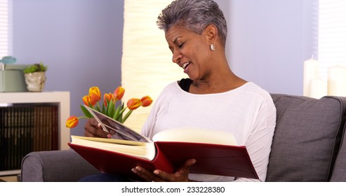 Mature Black Woman Looking Through Photo Album