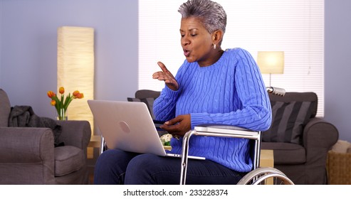 Mature Black Woman Talking With Friend On Laptop