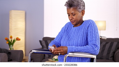 Mature Black Woman Texting On Smartphone