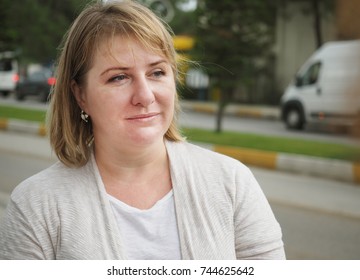 Mature Blonde Woman On The Street Portrait