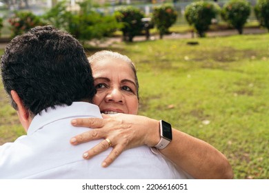 Mature Bride And Groom Embracing In The Open Air, Vow Renewal