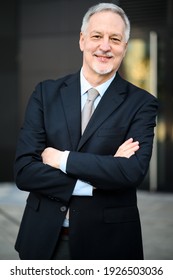 Mature Business Man Portrait Outdoor With Folded Arms