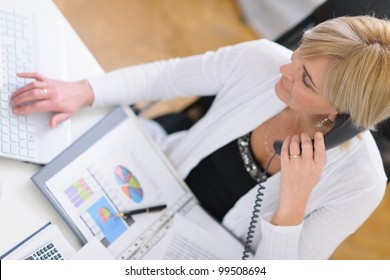 Mature Business Woman Making Phone Call. Top View