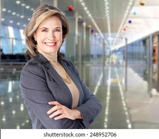 Mature business woman on modern office background.