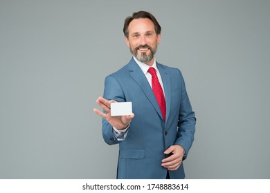 Mature Businessman Hold Business Card. Professional Auditor Man In Formal Suit. Confident Male Manager. Place For Copy Space. Ceo In Office Jacket Demonstrate Bank Credit Card.