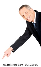 Mature Businessman Pointing Down On The Floor.