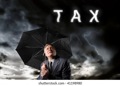 mature businessman under a storm of taxes
