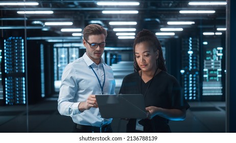 Mature Businesswoman Listens to Professional Advisor in Her Office, They Discuss Data Show on a Laptop. Smart Businesspeople Working in Finance. Specialists Work in Diverse Team. Big Data Concept - Shutterstock ID 2136788139