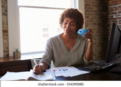 Mature Businesswoman Working In Office