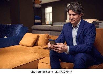 Mature Caucasian Man, Businessman, Entrepreneur, Sales Rep, Retail Manager Holding A Mobile Phone, Typing Text Messages, Surfing, Browsing, Swiping Websites. Business, Internet, Communication Concept