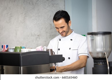 Mature Chef In Kitchen Cooking Dish For Dinner With Smile, 30-40 Year Old.