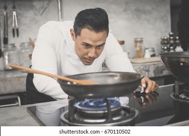 Mature Chef In Kitchen Cooking Dish For Dinner , 30-40 Year Old, Vintage Tone.