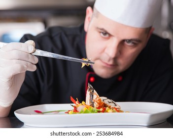 mature chef preparing a meal with various vegetables - Powered by Shutterstock