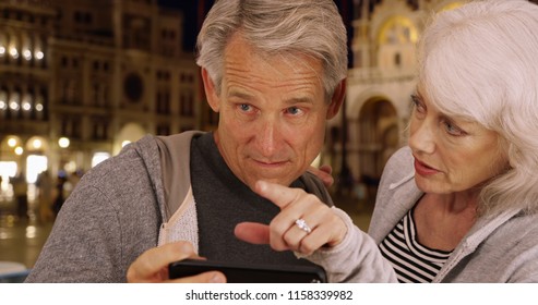 Mature Couple Arguing About Directions In Venice