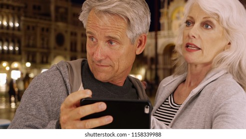 Mature Couple Arguing About Directions In Venice