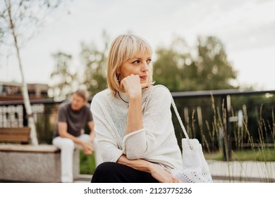 Mature Couple In A Bad Mental Condition After A Quarrel Outdoors. Adult Couple Man And Woman Trying To Overcome Anxiety And Disorder After A Break-up Scene.