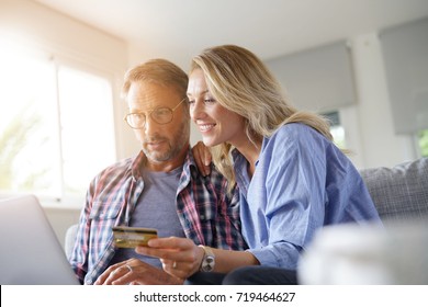 Mature Couple Buying On Internet, Online Shopping